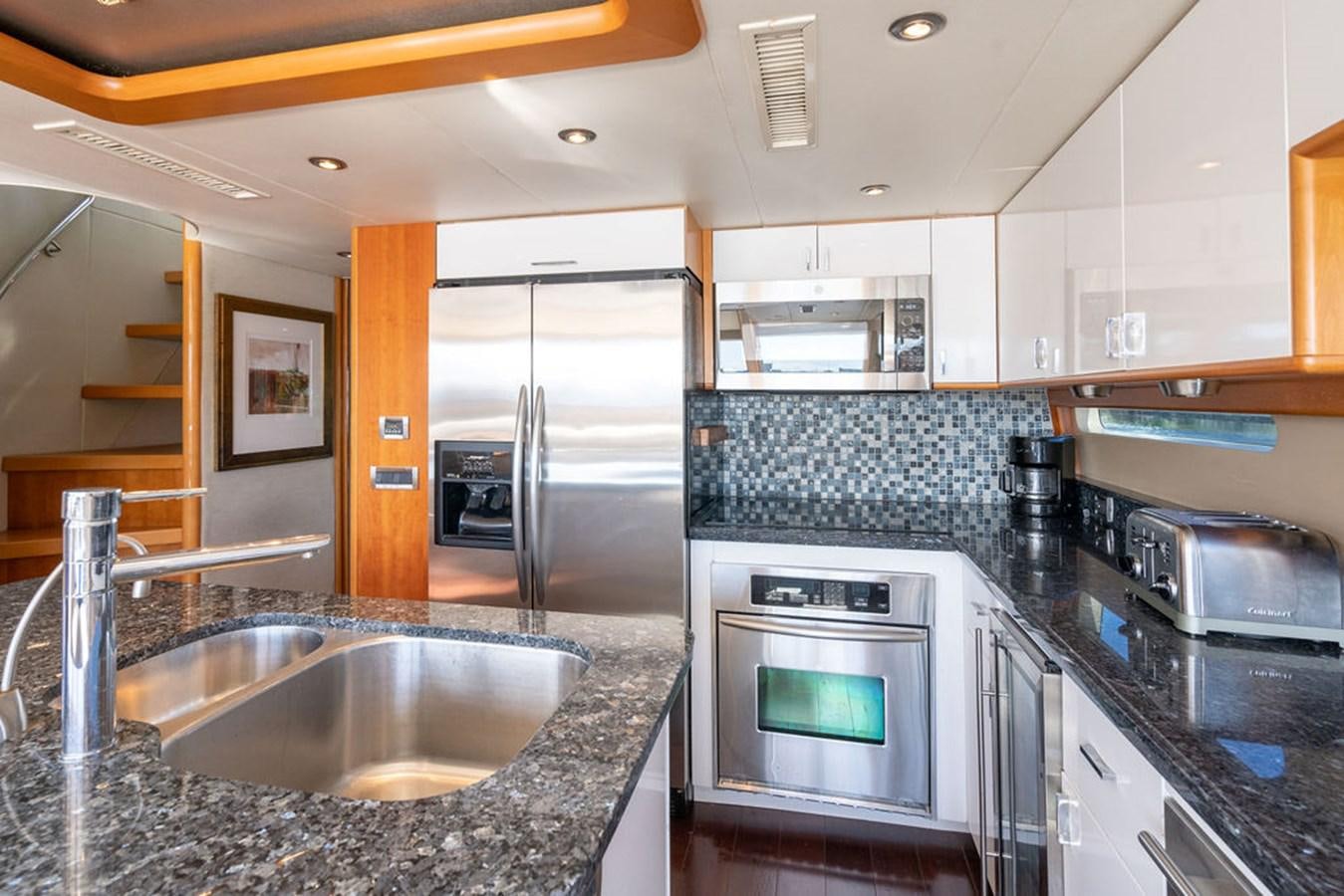 a kitchen with stainless steel appliances aboard CHIP Yacht for Sale