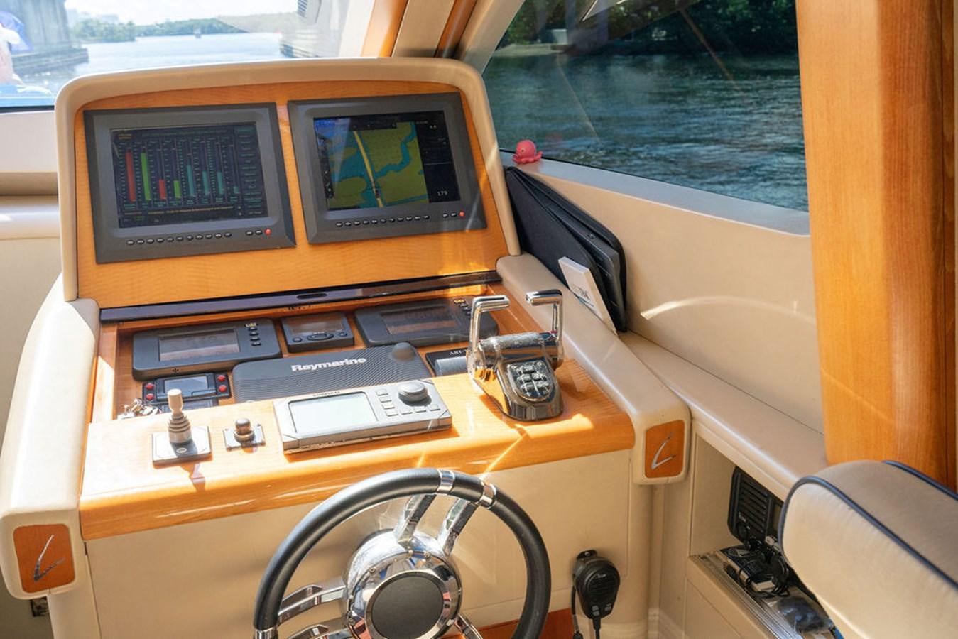 a yellow vehicle with a screen aboard CHIP Yacht for Sale