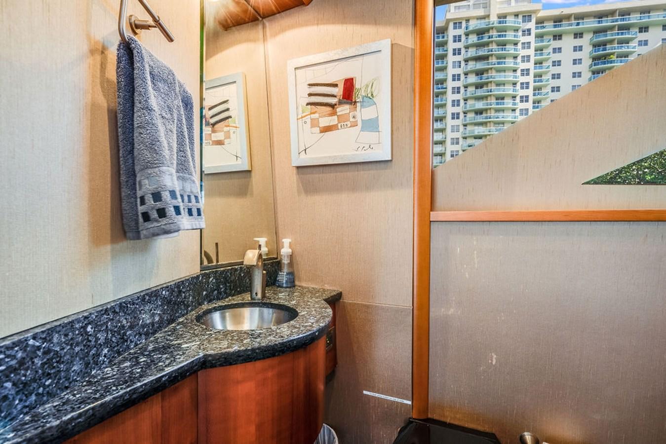 a bathroom with a sink and a mirror aboard CHIP Yacht for Sale
