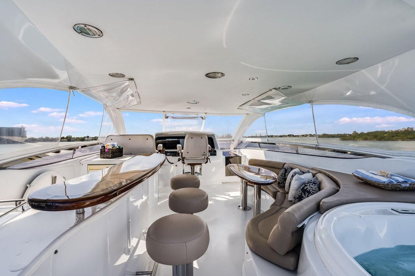 a room with a view of the water and the land below aboard CHIP Yacht for Sale