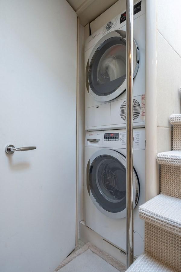 a white washing machine aboard CHIP Yacht for Sale