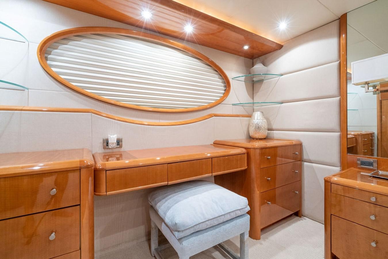 a room with a bed and a desk aboard CHIP Yacht for Sale