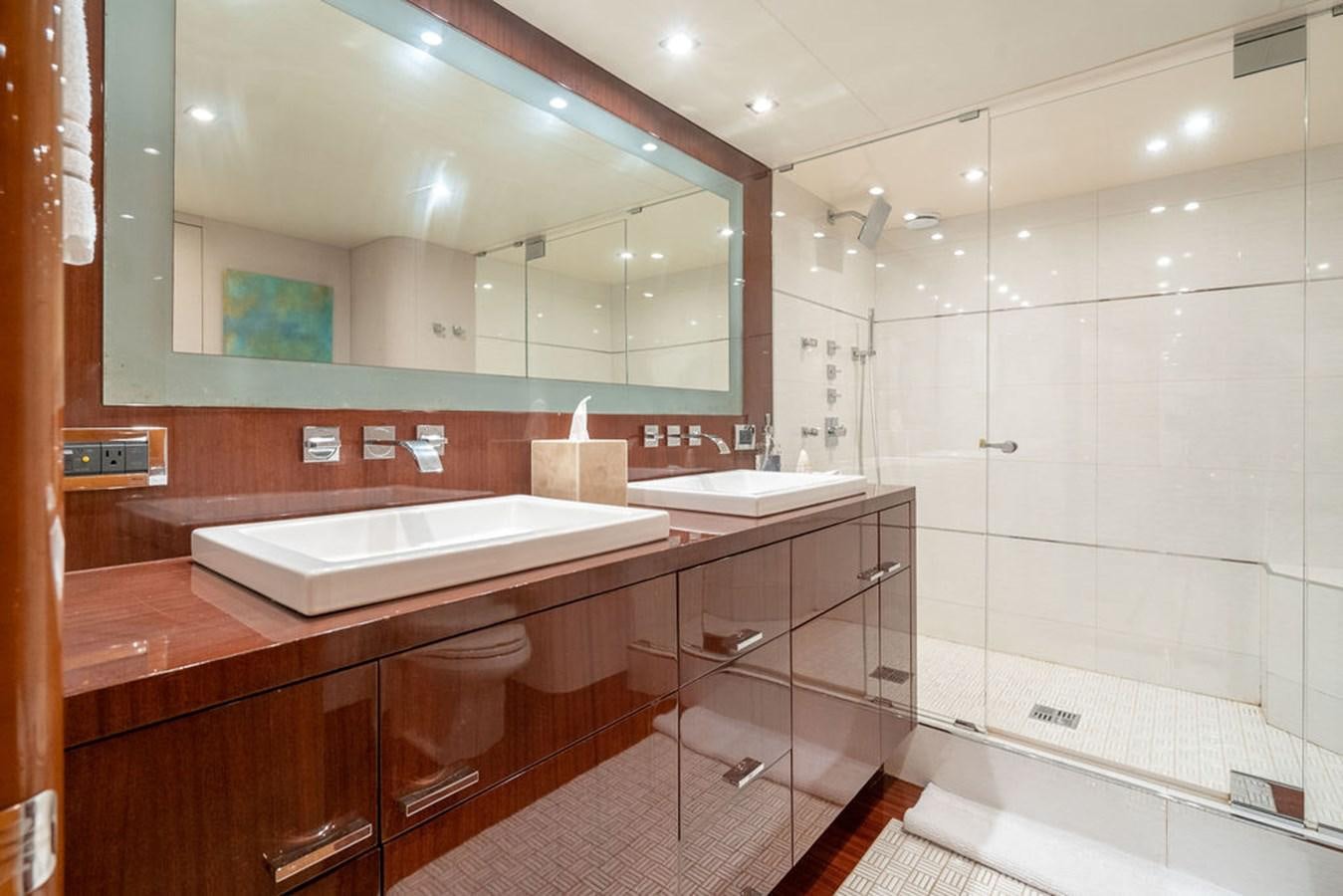 a bathroom with a large mirror aboard CHIP Yacht for Sale