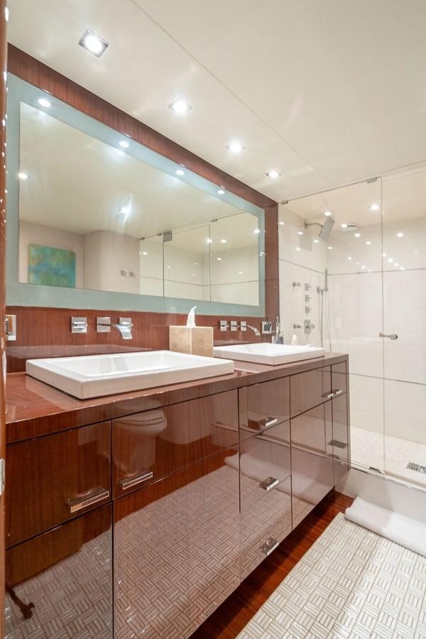 a bathroom with a large mirror aboard CHIP Yacht for Sale