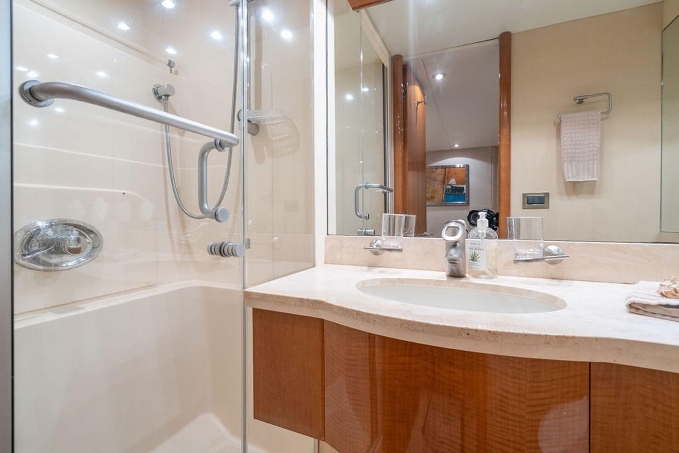 a bathroom with a sink and a shower aboard CHIP Yacht for Sale