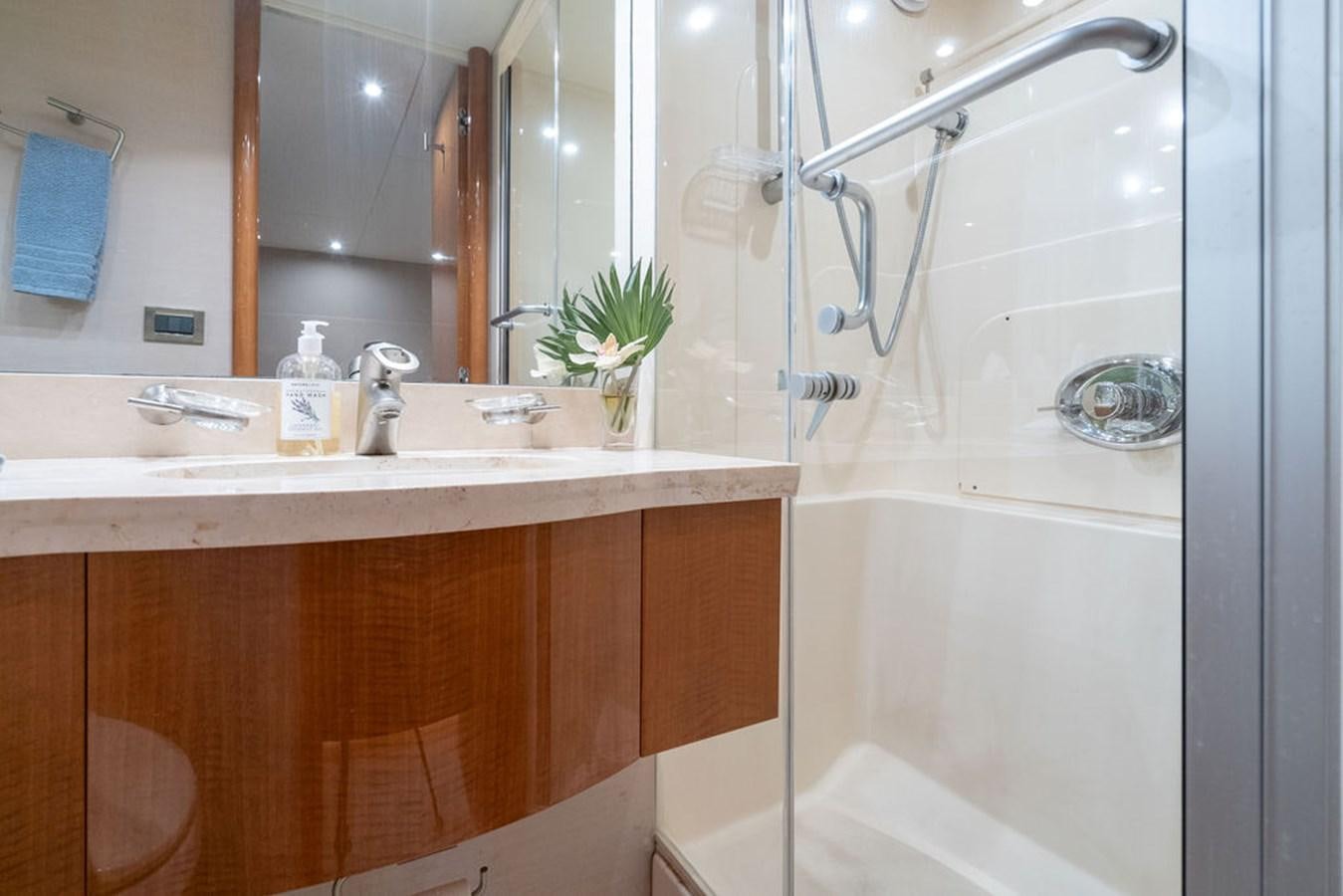 a bathroom with a shower and sink aboard CHIP Yacht for Sale