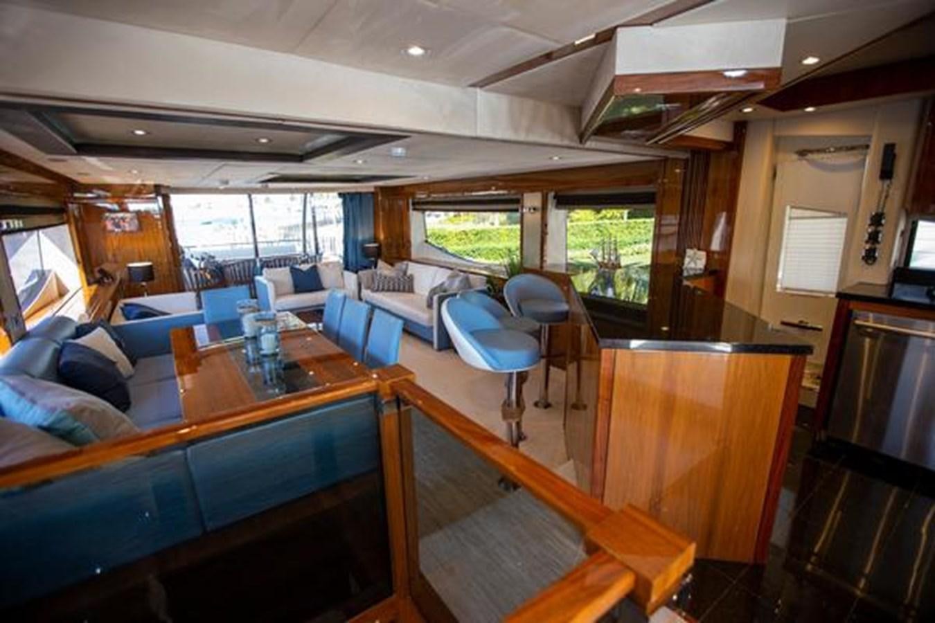 a room with a table chairs and a window aboard THE CABANA Yacht for Sale