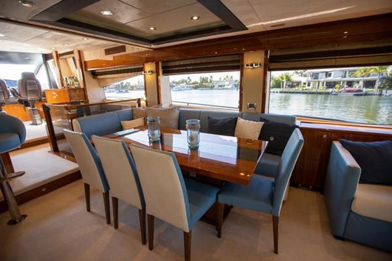 a table and chairs in a room aboard THE CABANA Yacht for Sale