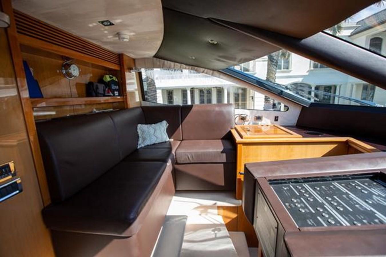 a living room with a couch and a piano aboard THE CABANA Yacht for Sale