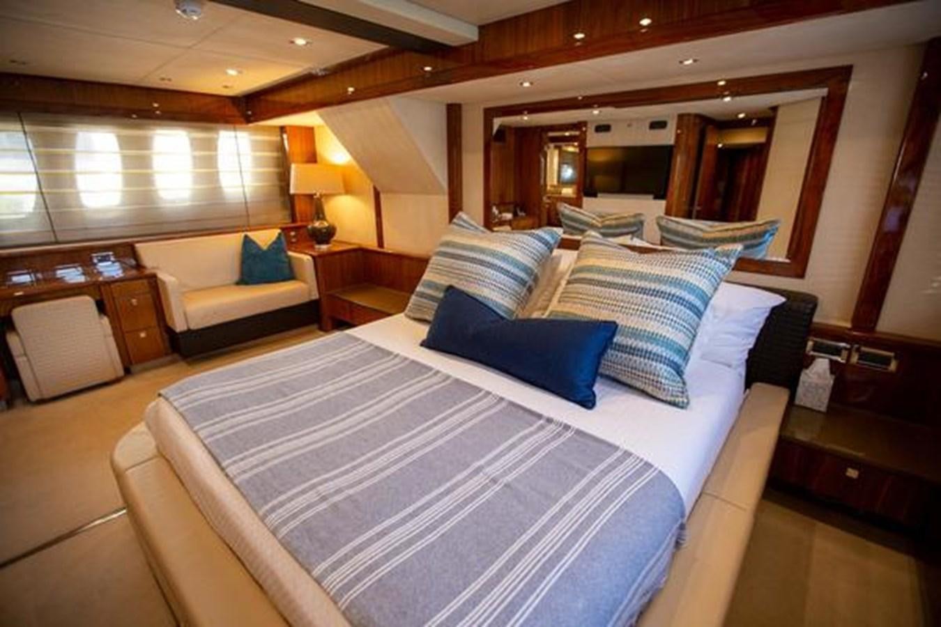 a hotel room with a bed and a couch aboard THE CABANA Yacht for Sale