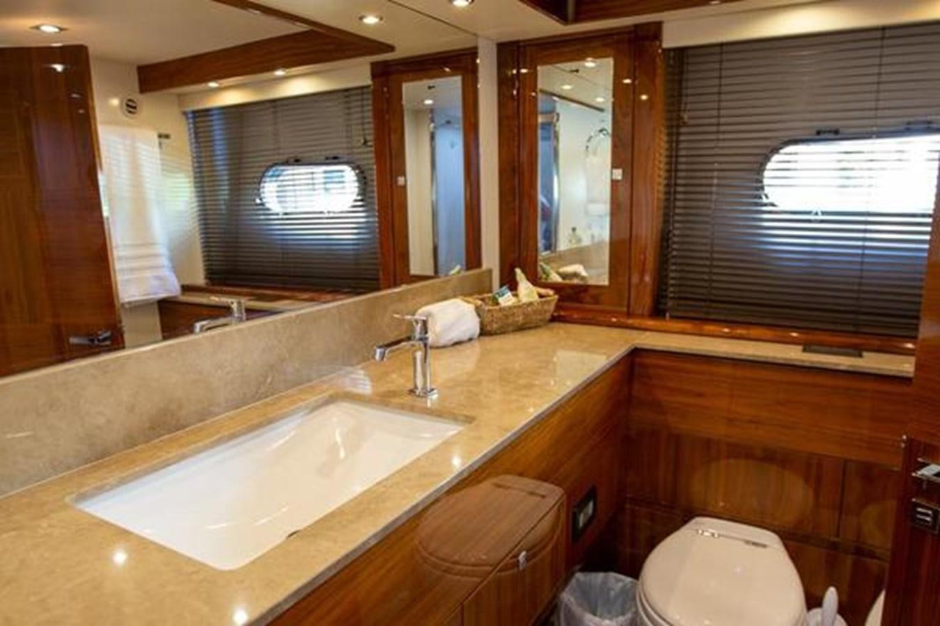 a bathroom with a large mirror aboard THE CABANA Yacht for Sale
