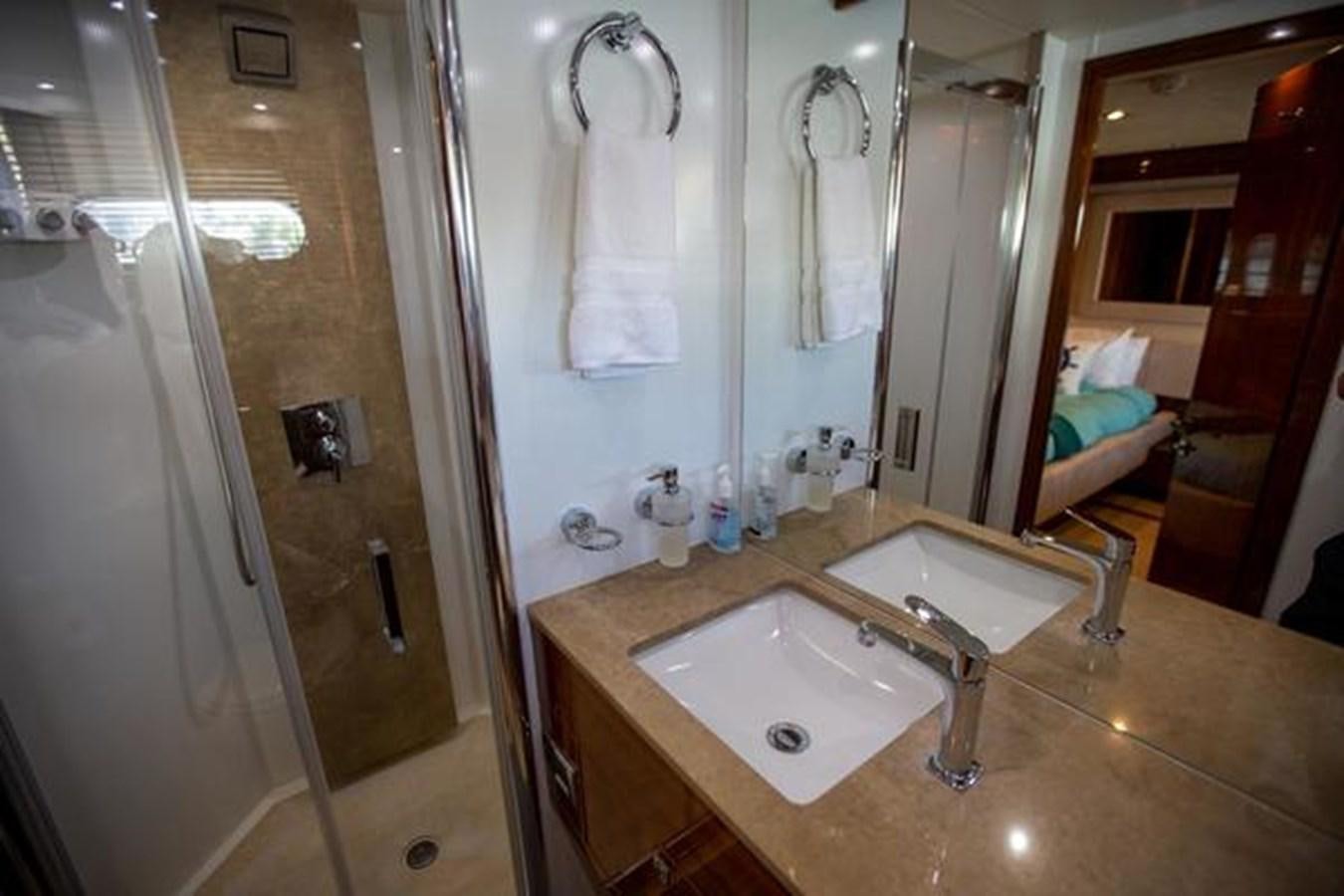 a bathroom with a sink and a mirror aboard THE CABANA Yacht for Sale