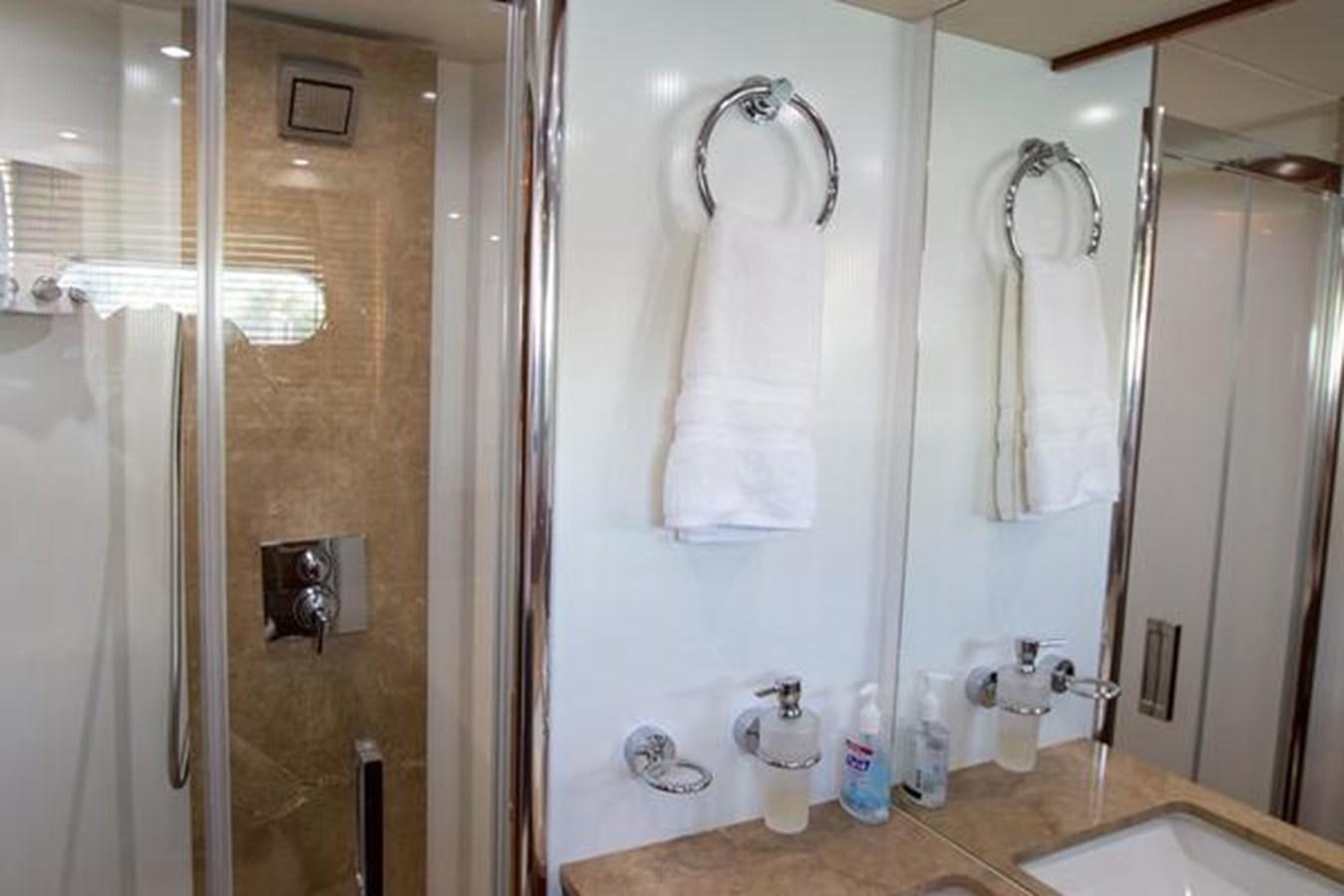 a bathroom with a large mirror aboard THE CABANA Yacht for Sale