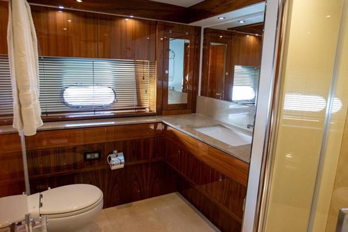a bathroom with a large window aboard THE CABANA Yacht for Sale