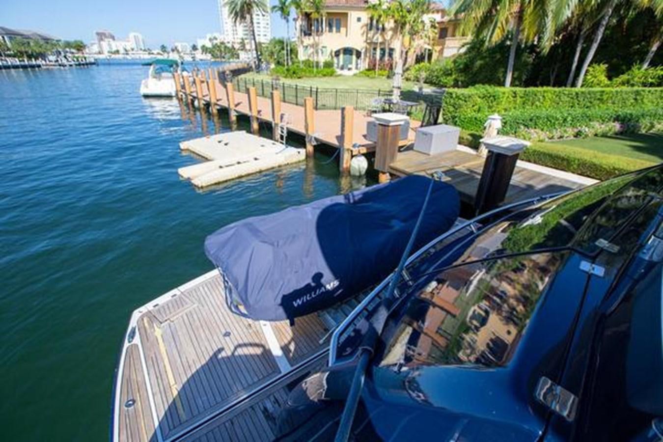 a boat docked at a pier aboard THE CABANA Yacht for Sale