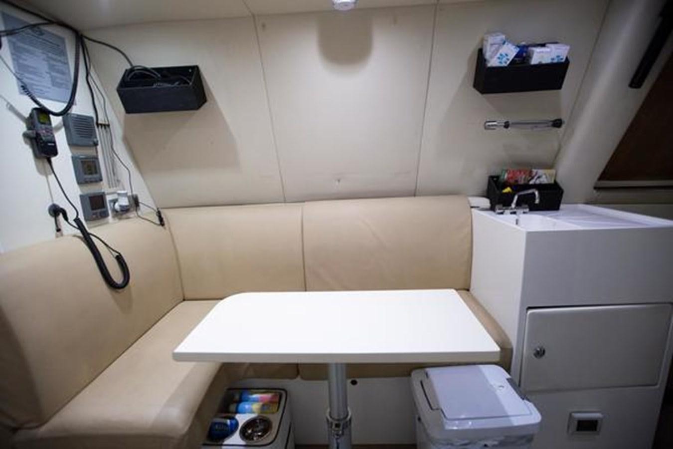 a white table with a white table aboard THE CABANA Yacht for Sale