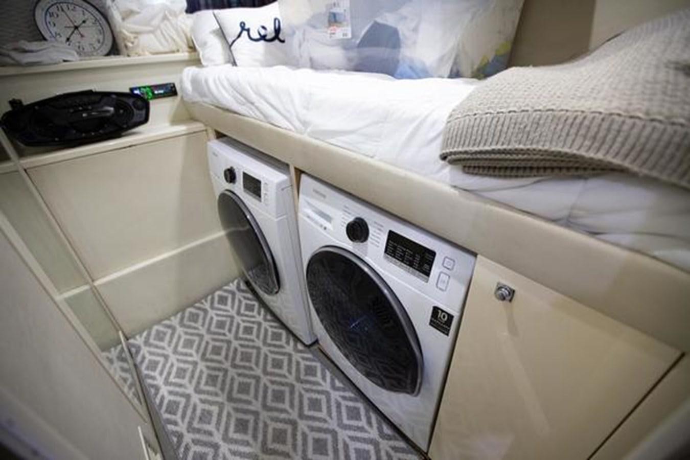 a washing machine in a room aboard THE CABANA Yacht for Sale