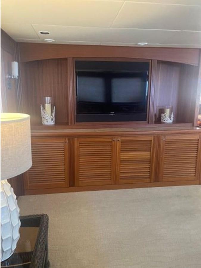 a kitchen with wooden cabinets aboard ALLSEAS 92 EXPEDITION Yacht for Sale
