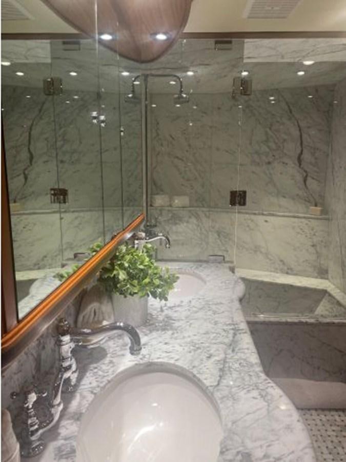 a bathroom with a large mirror aboard ALLSEAS 92 EXPEDITION Yacht for Sale