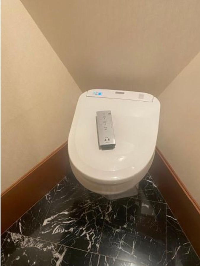 a white toilet in a bathroom aboard ALLSEAS 92 EXPEDITION Yacht for Sale