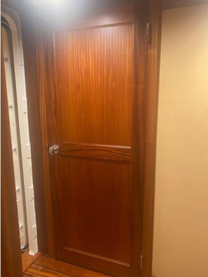 a wooden door with a handle aboard ALLSEAS 92 EXPEDITION Yacht for Sale