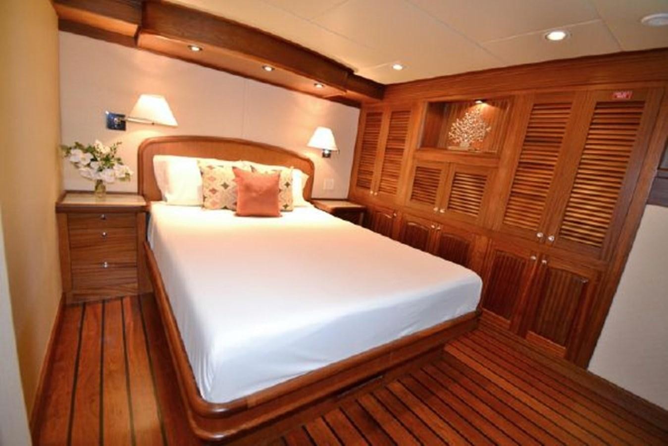 a bed in a room aboard ALLSEAS 92 EXPEDITION Yacht for Sale