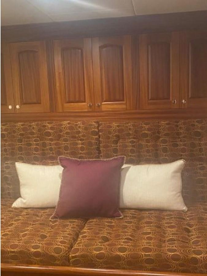 a bed with white pillows aboard ALLSEAS 92 EXPEDITION Yacht for Sale