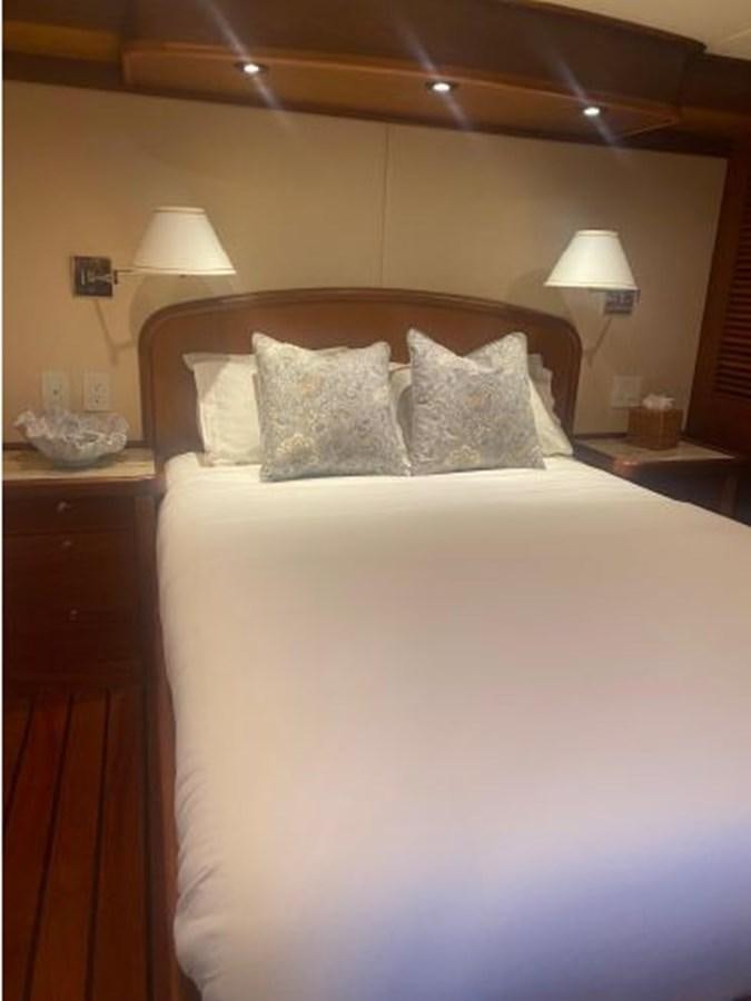 a bed with white sheets aboard ALLSEAS 92 EXPEDITION Yacht for Sale