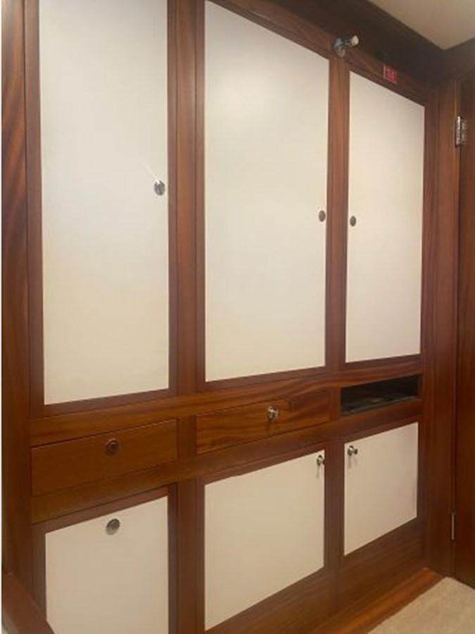 a room with wooden cabinets aboard ALLSEAS 92 EXPEDITION Yacht for Sale