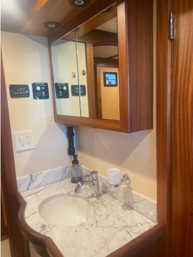 a bathroom with a mirror and a sink aboard ALLSEAS 92 EXPEDITION Yacht for Sale