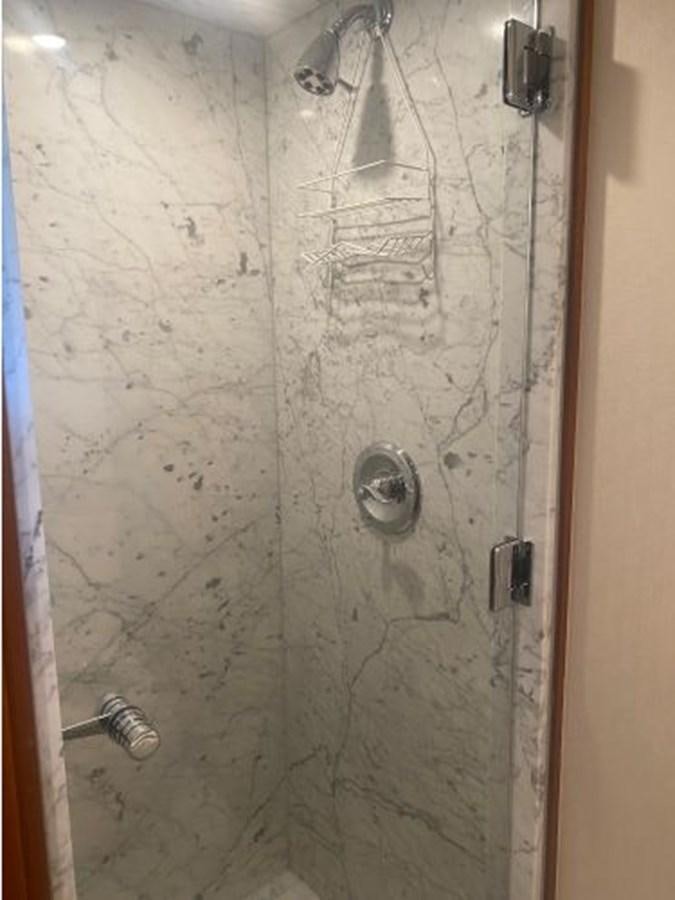 a shower with a tile wall aboard ALLSEAS 92 EXPEDITION Yacht for Sale
