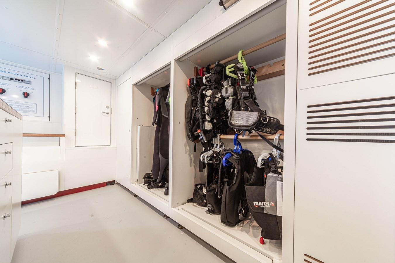 a room with a large rack of clothes from the ceiling aboard K584 HULL 2 Yacht for Sale