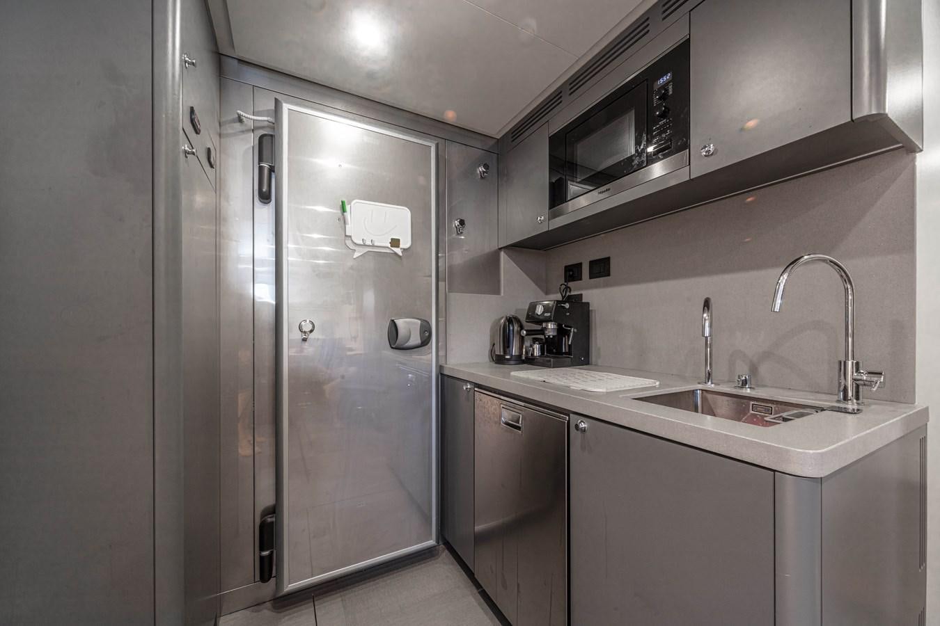 a kitchen with a refrigerator and sink aboard K584 HULL 2 Yacht for Sale