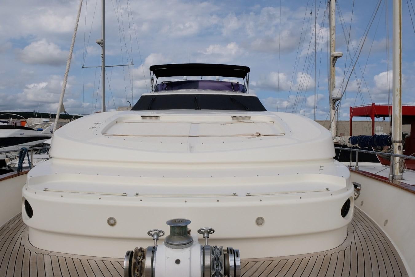a white yacht on a dock aboard WONDERLAND Yacht for Sale
