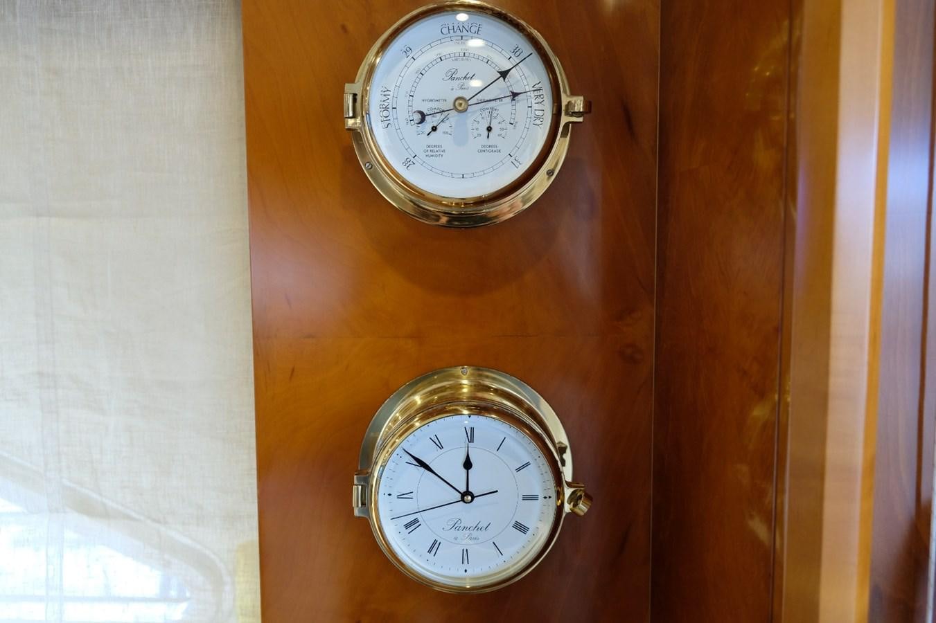 a clock on a wall aboard WONDERLAND Yacht for Sale