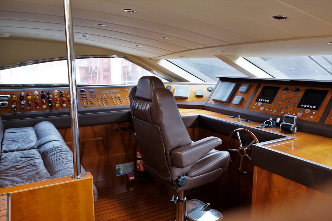 a bus with seats and a desk aboard WONDERLAND Yacht for Sale