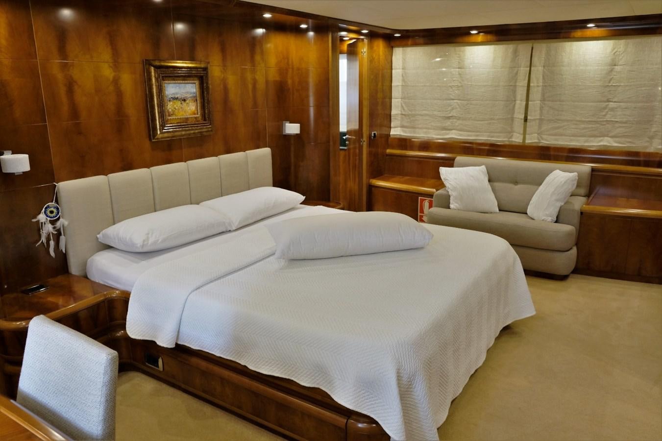 a room with a bed and a couch aboard WONDERLAND Yacht for Sale