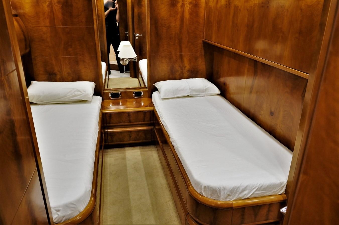 a room with a bed and a mirror aboard WONDERLAND Yacht for Sale