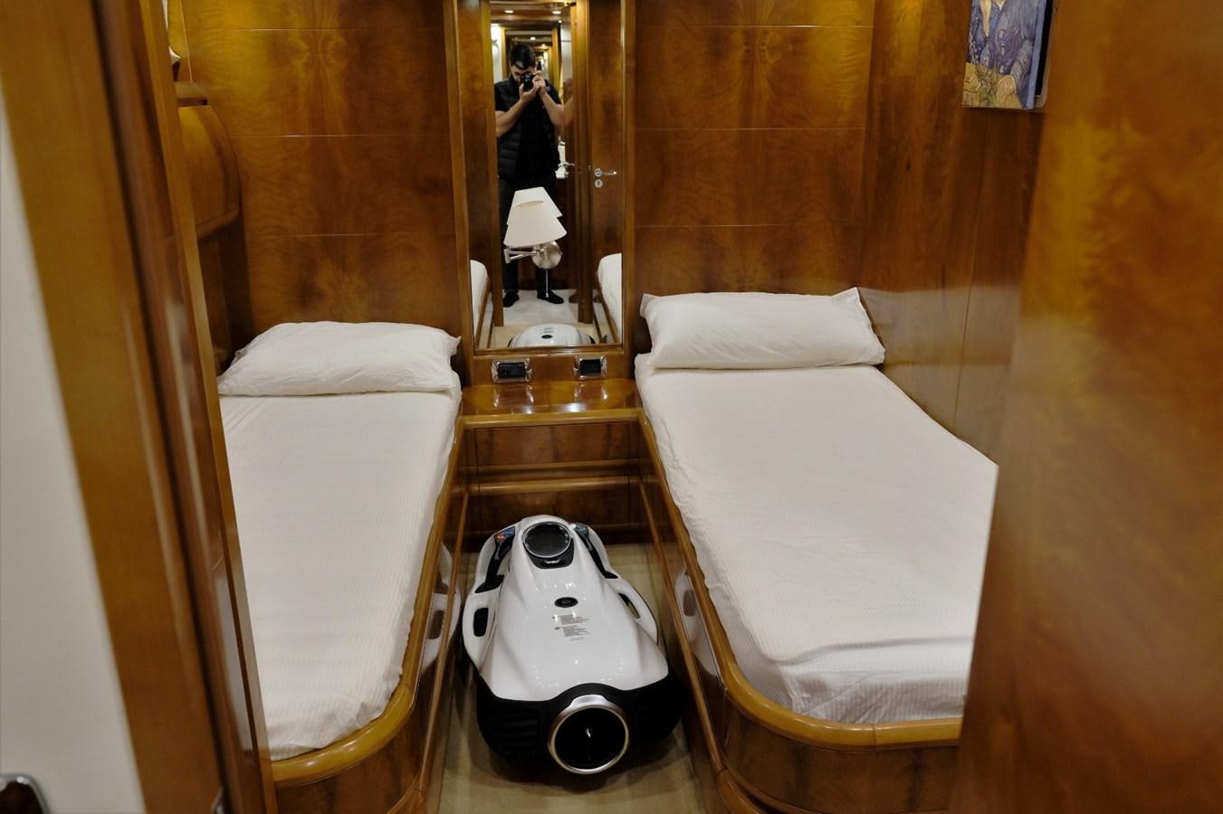 a mirror is above a bed aboard WONDERLAND Yacht for Sale