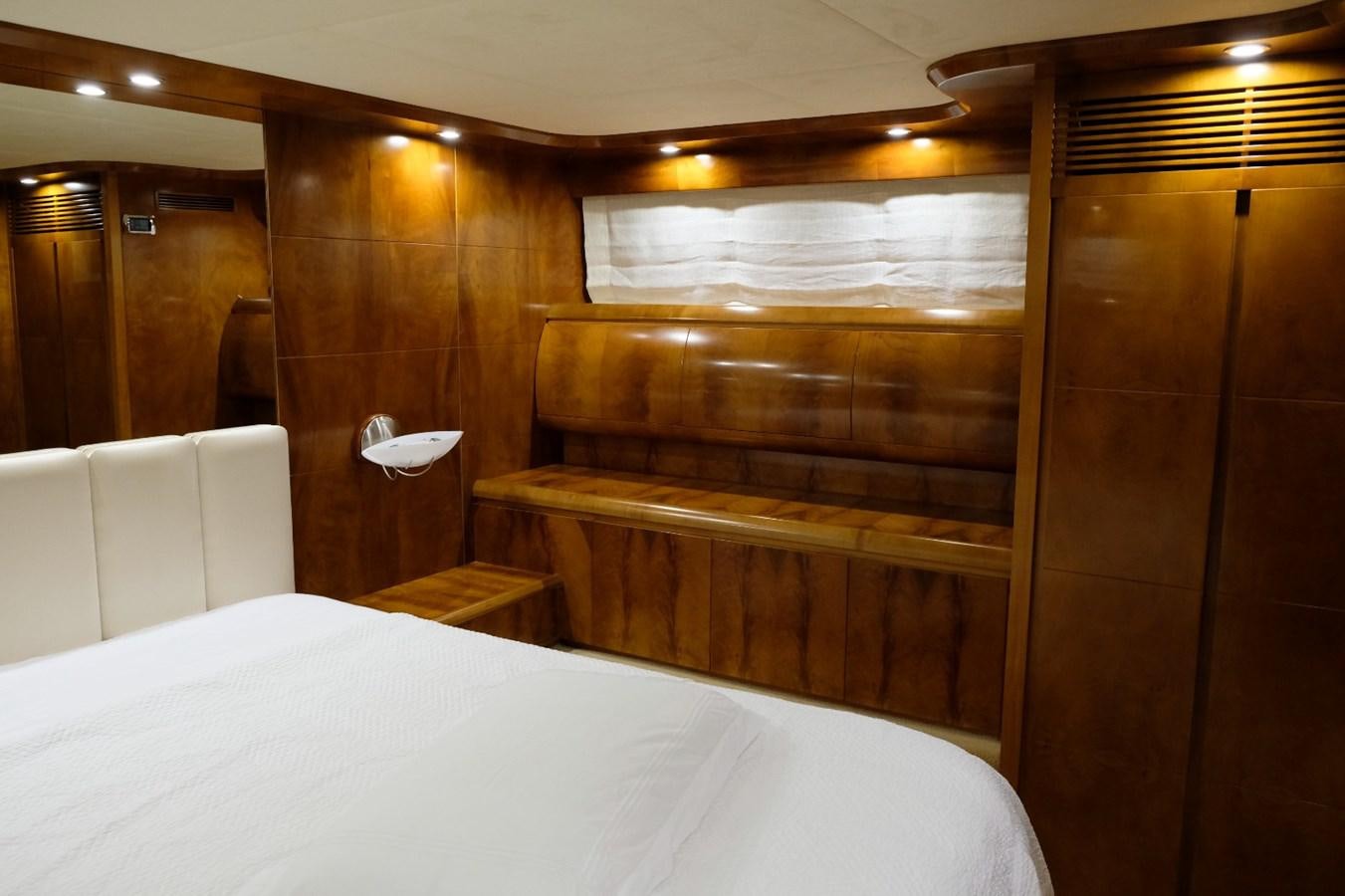 a room with wooden cabinets aboard WONDERLAND Yacht for Sale