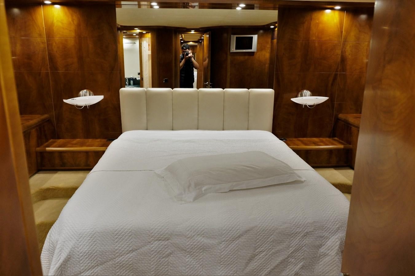 a bed with white sheets aboard WONDERLAND Yacht for Sale