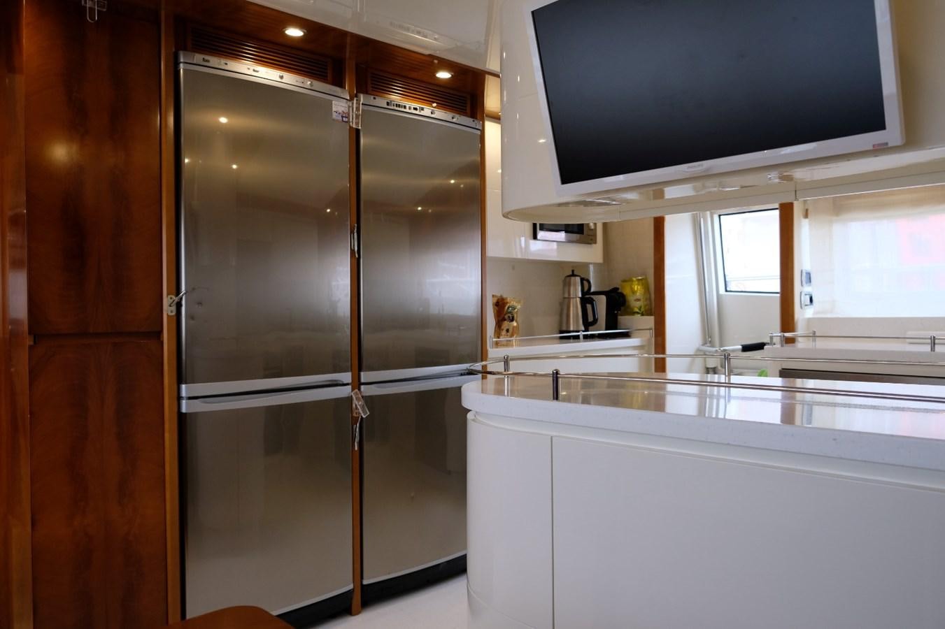 a kitchen with a large glass shower aboard WONDERLAND Yacht for Sale