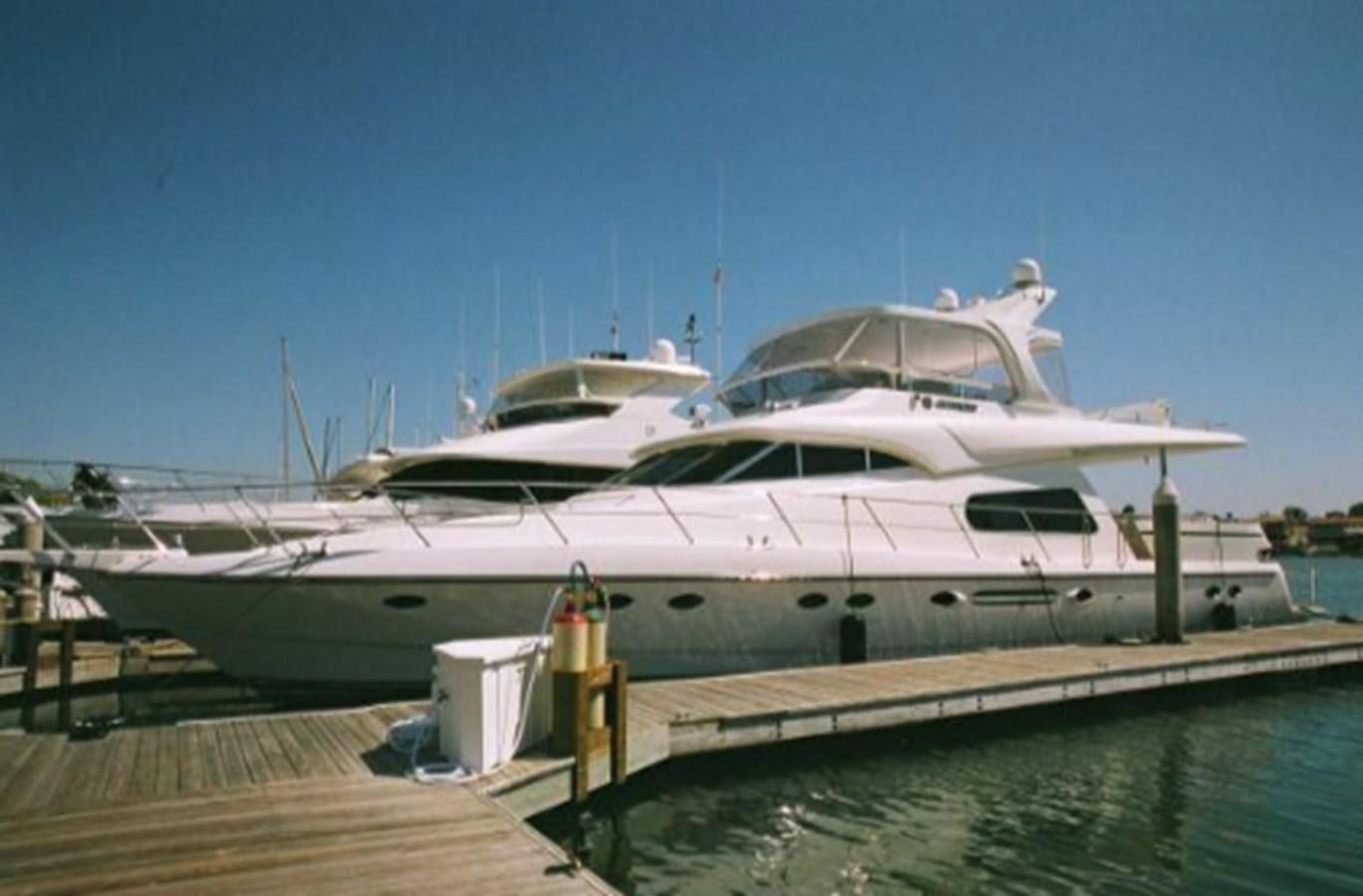 a large white yacht docked aboard THE FLYING WASP Yacht for Sale