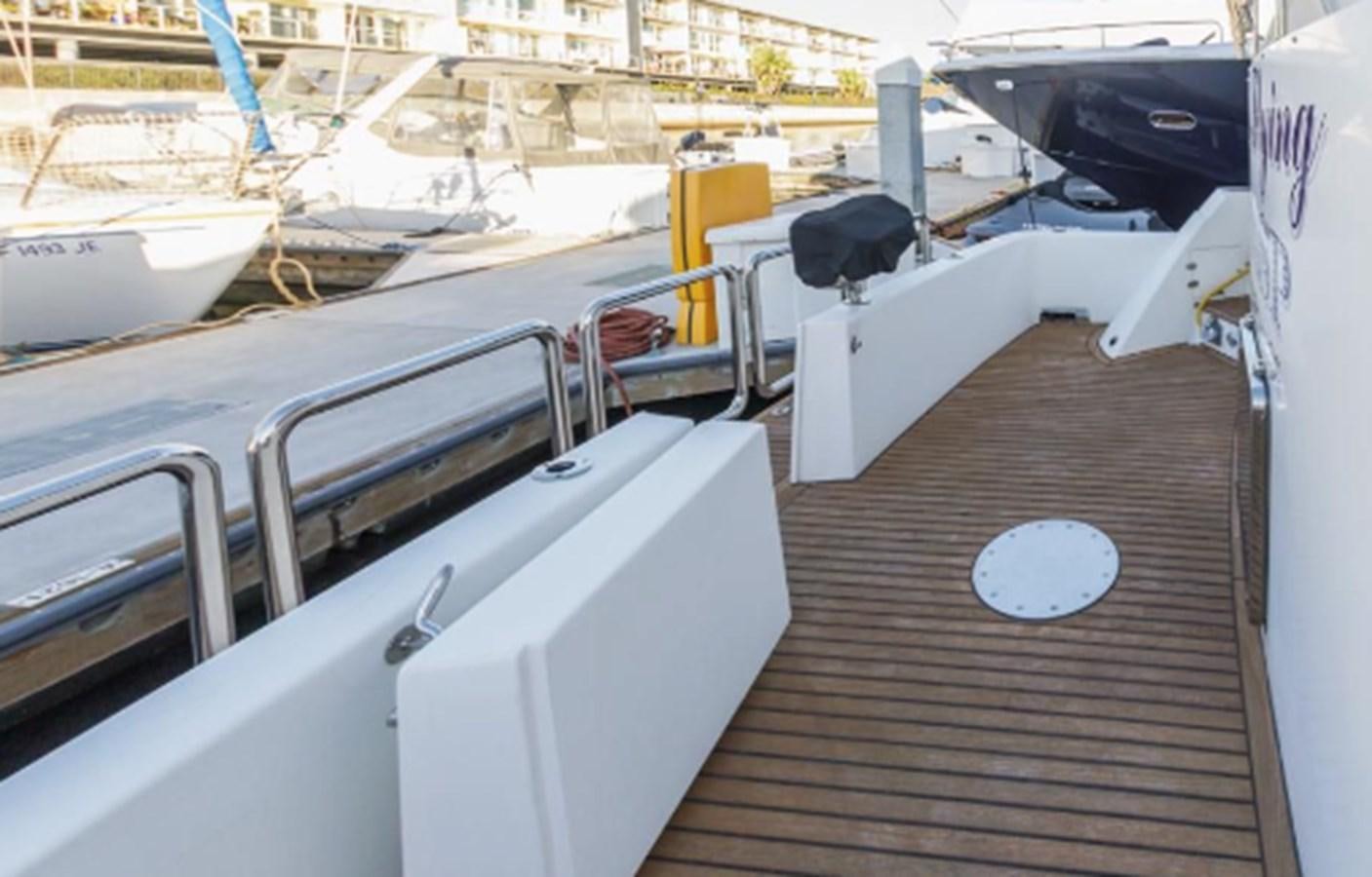 a deck with boats aboard THE FLYING WASP Yacht for Sale