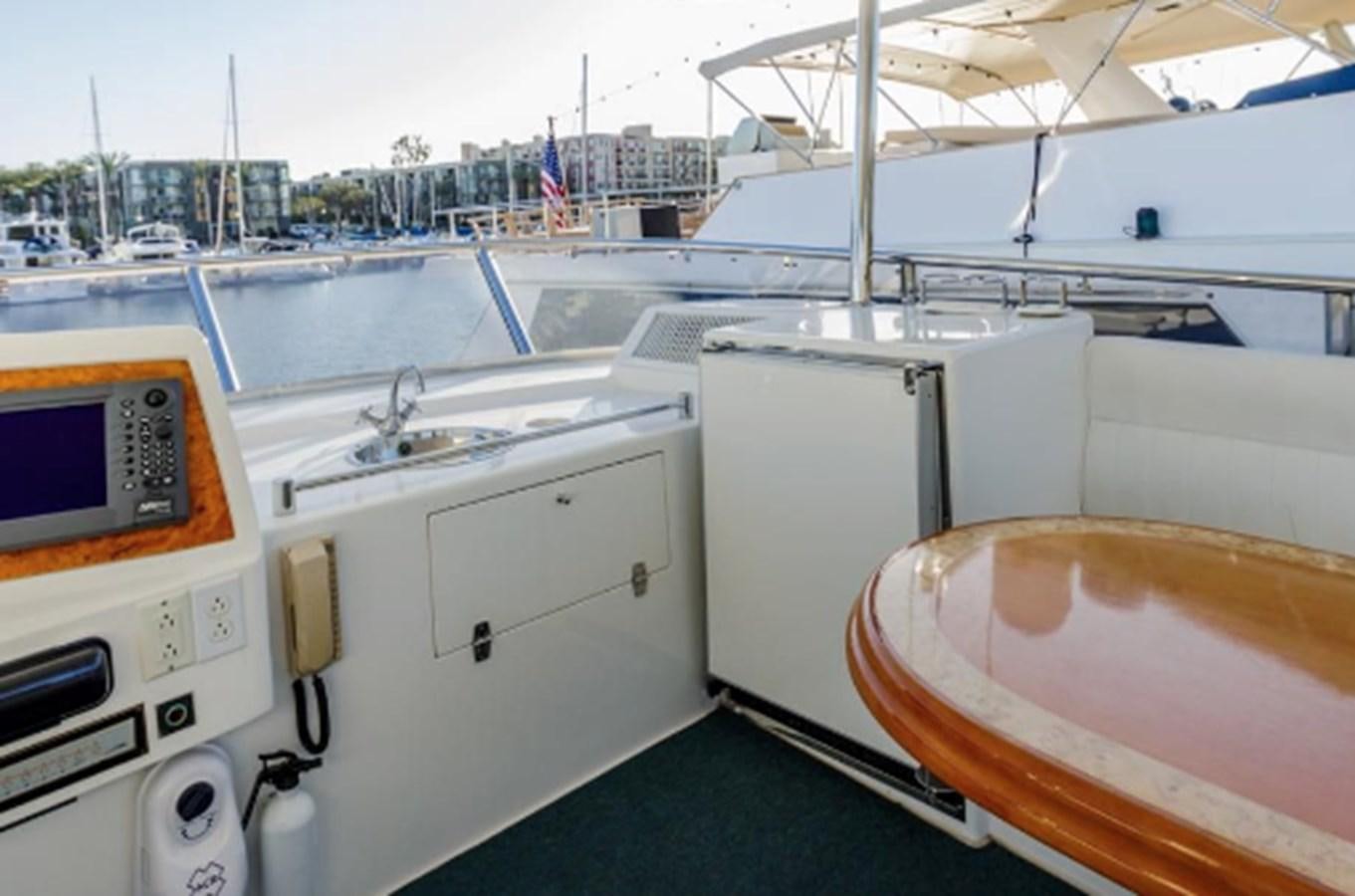 a boat deck with several boats aboard JOHNSON 70' FLYBRIDGE M/Y Yacht for Sale