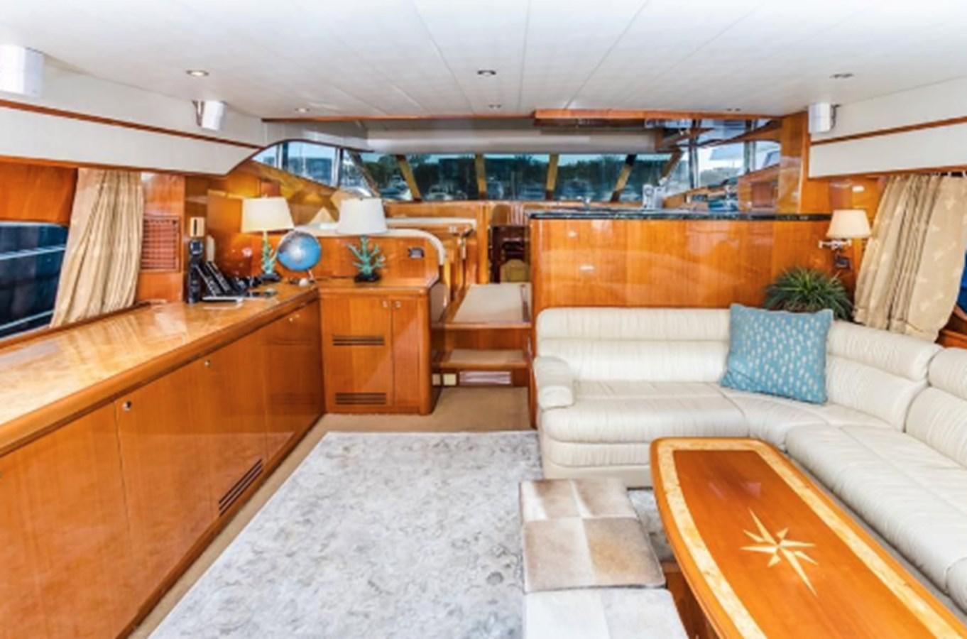 a living room with a couch and a table aboard THE FLYING WASP Yacht for Sale