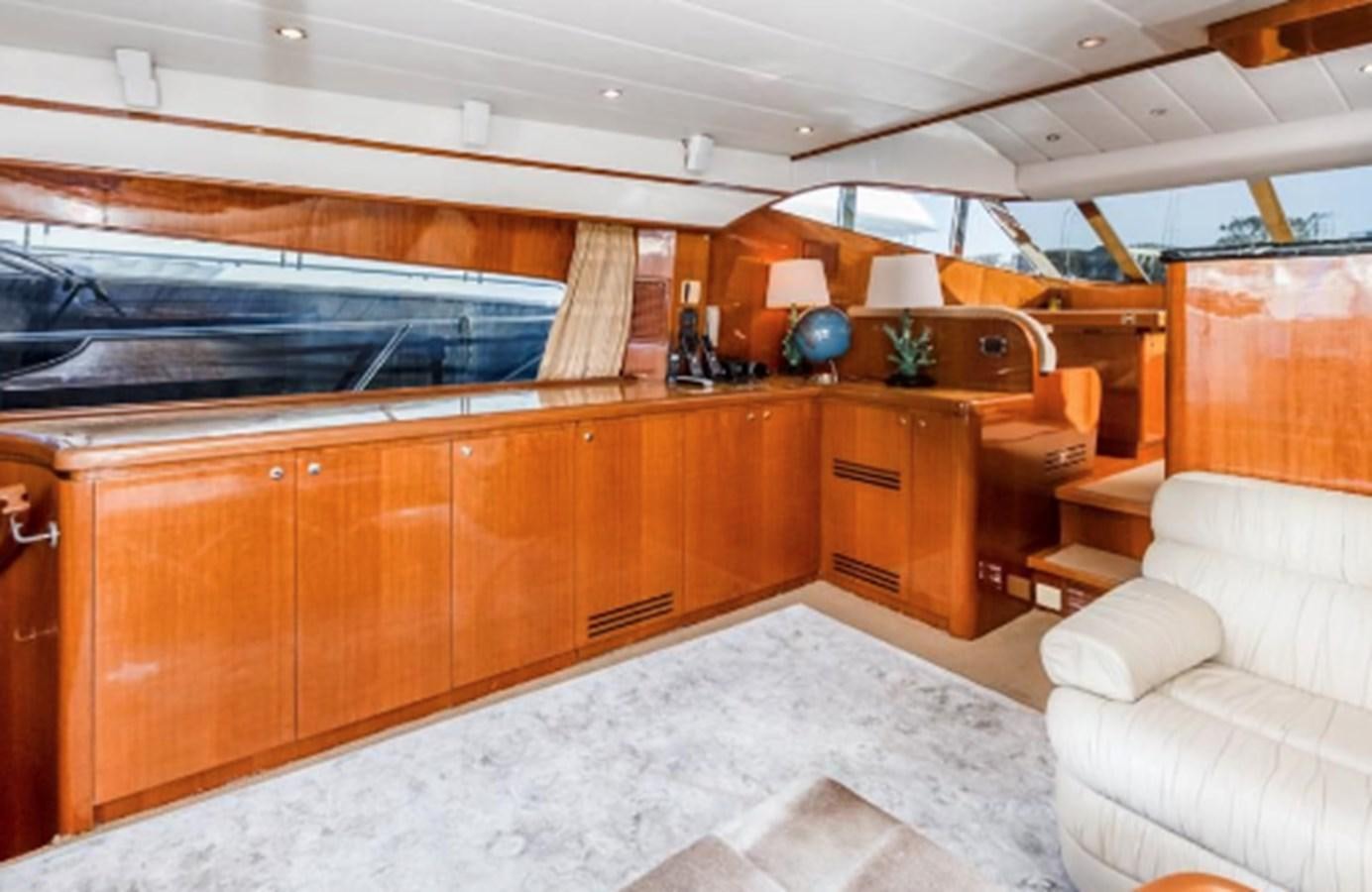 a kitchen with wooden cabinets aboard THE FLYING WASP Yacht for Sale