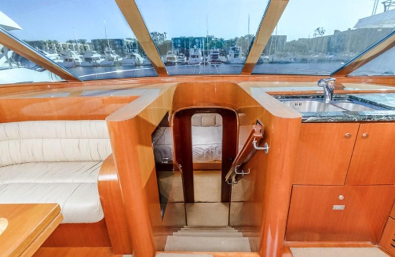 a boat with a chair aboard THE FLYING WASP Yacht for Sale