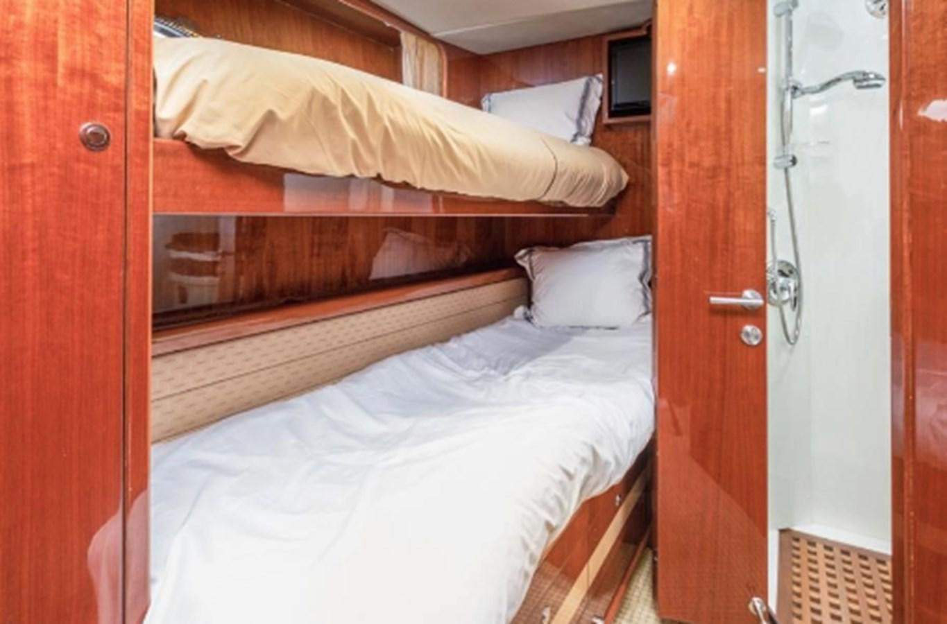 a room with two beds aboard THE FLYING WASP Yacht for Sale