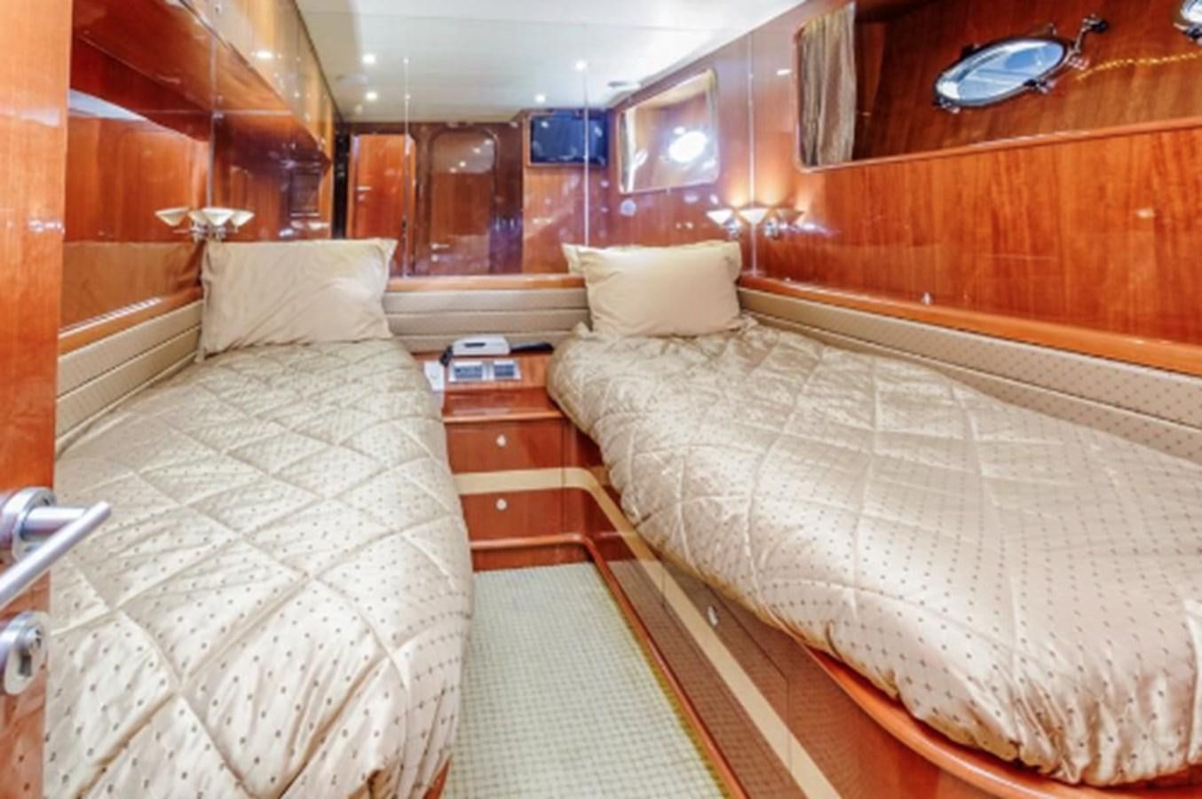 a room with two beds aboard THE FLYING WASP Yacht for Sale